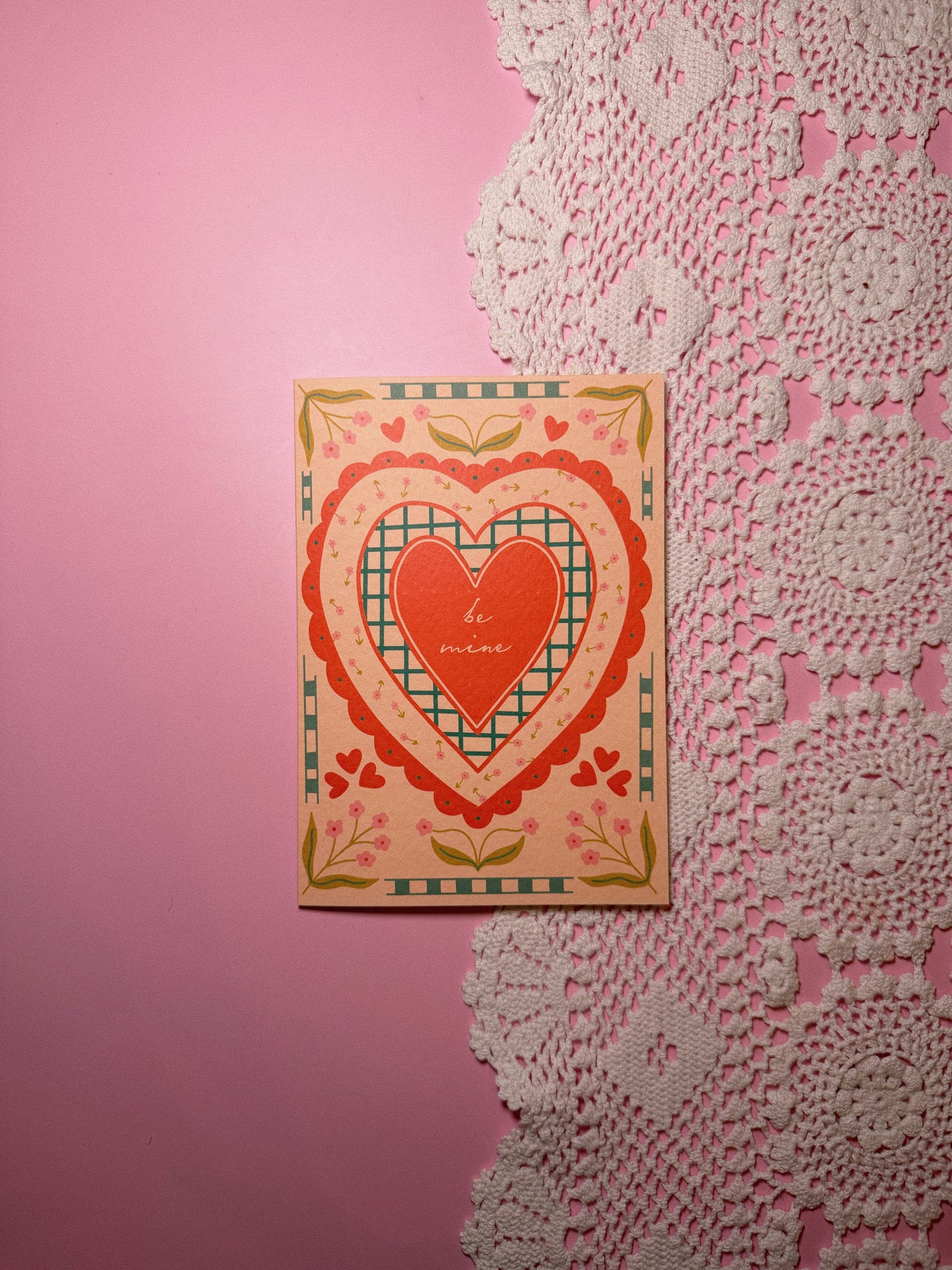 Red Heart Card by itself on a pink + lave background with the words Be Mine in the center set in a vintage style