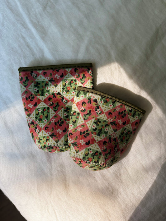 Quilt patterned pink cream and green coffee sleeve